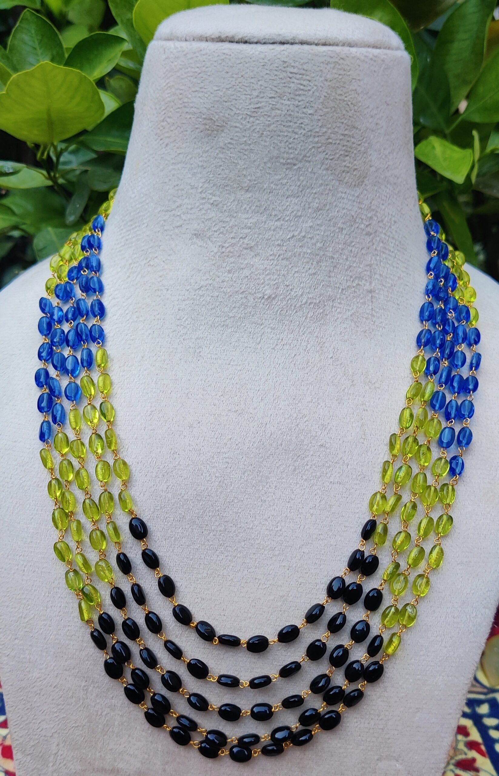 Elevate your look with this handcrafted multi-strand beaded necklace