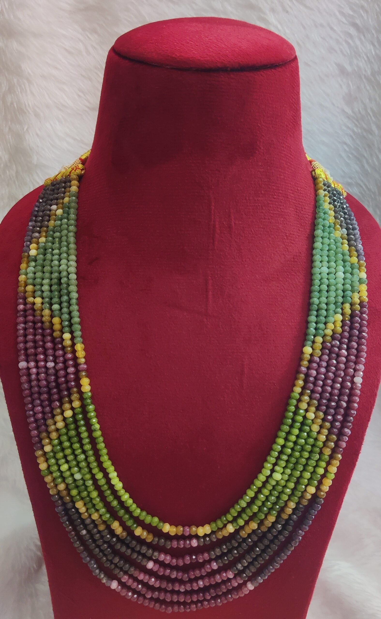 The Onex Necklace is a statement piece that blends artistry with elegance. Featuring multiple strands of finely crafted beads, it creates a cascading effect that enhances any outfit with vibrant sophistication.