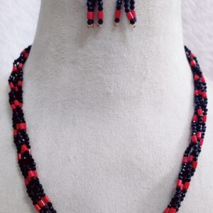 A striking handcrafted jewelry set featuring a twisted beadwork necklace paired with matching earrings. Designed to blend traditional artistry with bold modern aesthetics, this set is perfect for festive occasions, evening wear, or as a statement accessory.