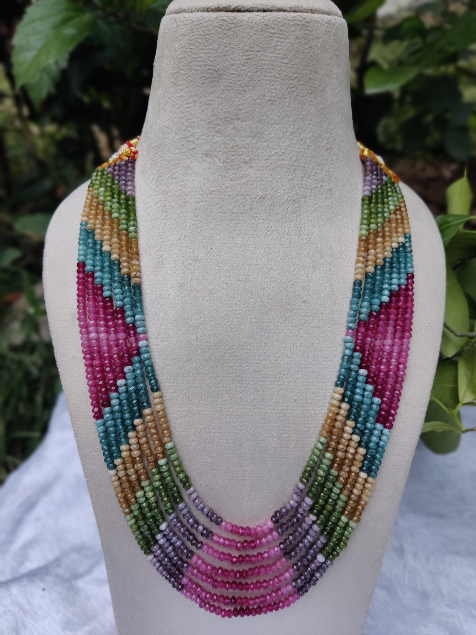 The Onex Necklace is a statement piece that blends artistry with elegance. Featuring multiple strands of finely crafted beads, it creates a cascading effect that enhances any outfit with vibrant sophistication. - Image 2